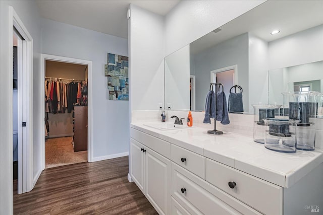 bathroom with wood-type flooring and vanity