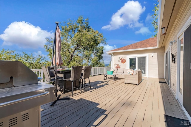 deck featuring grilling area and an outdoor hangout area