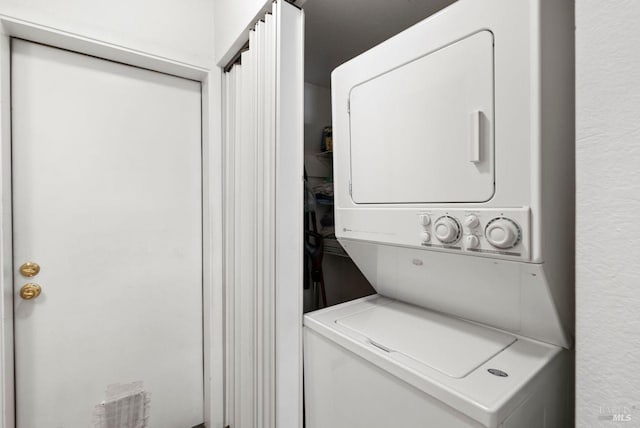 laundry area with stacked washer and dryer