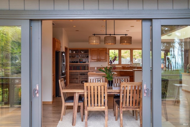 dining area featuring light wood-type flooring