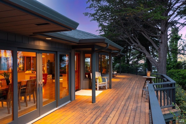 deck at dusk with french doors