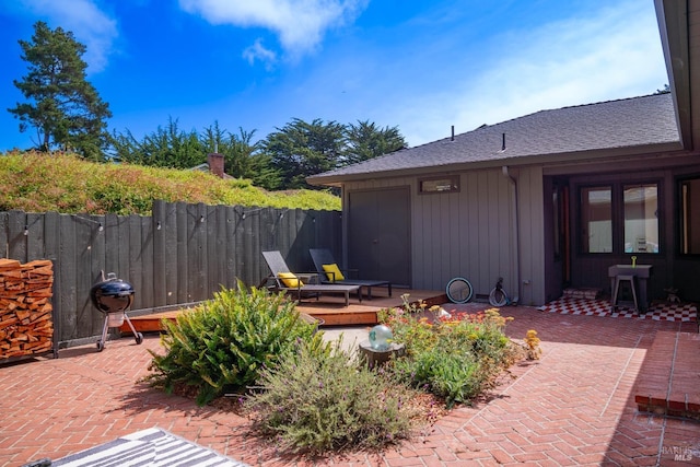 view of patio / terrace with a wooden deck and french doors