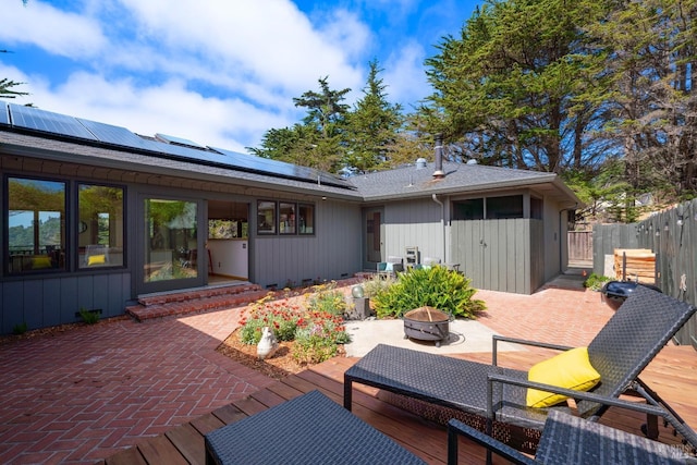 exterior space featuring a patio area and a fire pit