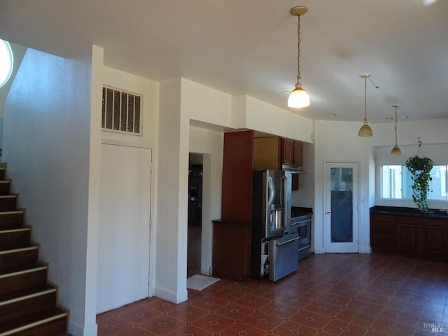 kitchen featuring decorative light fixtures and stainless steel appliances