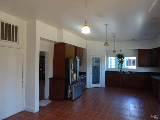 kitchen with pendant lighting, dishwasher, and sink