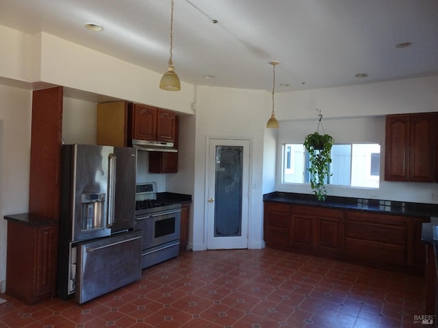 kitchen featuring stainless steel appliances and decorative light fixtures