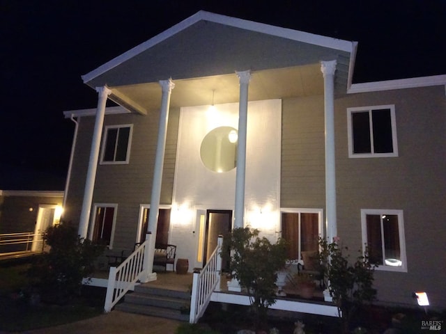 rear view of house with a lawn