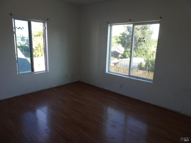 bedroom with ceiling fan and dark wood-type flooring