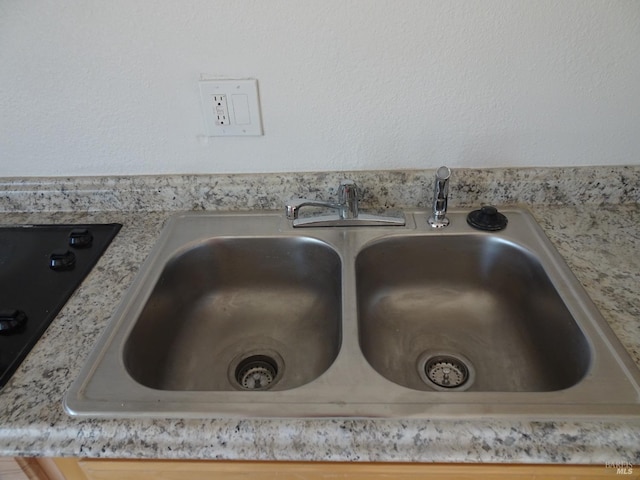 interior details featuring black electric stovetop