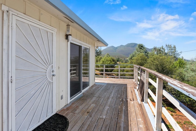 wooden deck featuring a mountain view