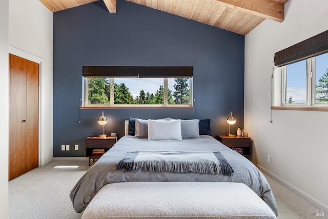 carpeted bedroom with wood ceiling, high vaulted ceiling, a closet, and beam ceiling