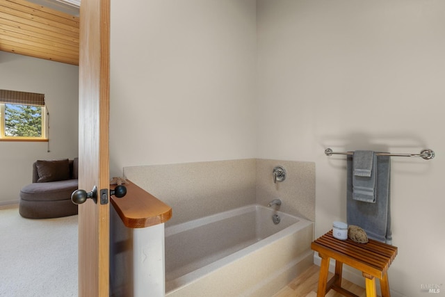 full bath with a bath and wood ceiling
