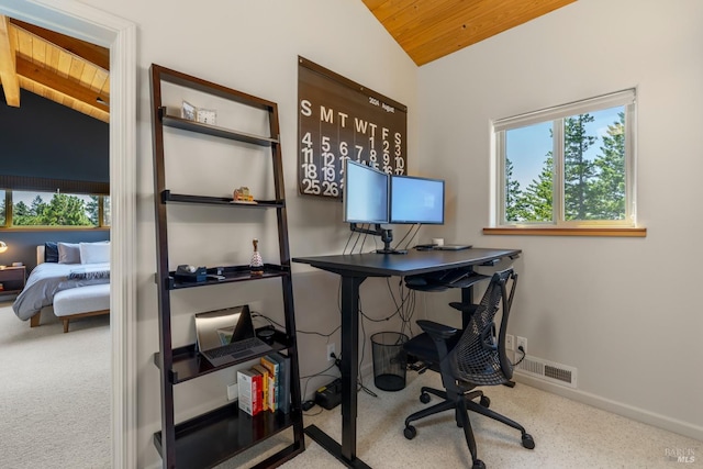 carpeted office space with wood ceiling, vaulted ceiling with beams, and plenty of natural light