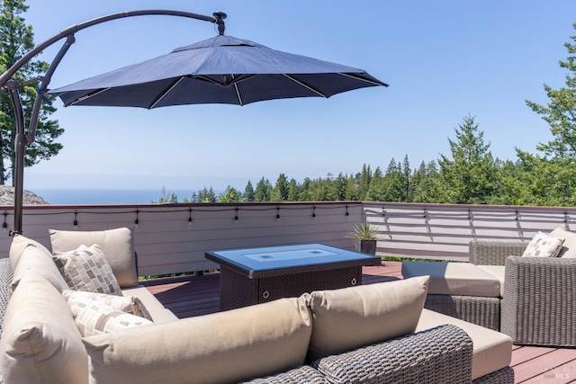 deck with an outdoor hangout area and a hot tub