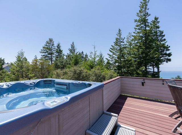 view of pool featuring a hot tub and a wooden deck