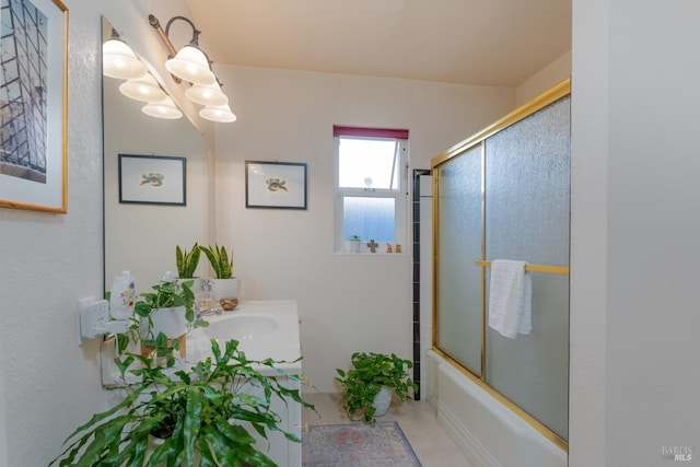 bathroom featuring tile patterned flooring, vanity, a notable chandelier, and combined bath / shower with glass door