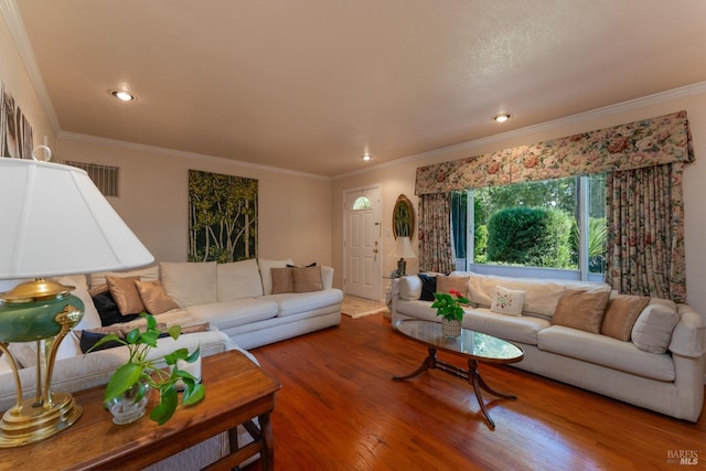 living room featuring crown molding and hardwood / wood-style floors