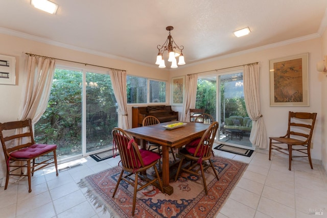 dining space featuring a notable chandelier, light tile patterned flooring, ornamental molding, and a wealth of natural light