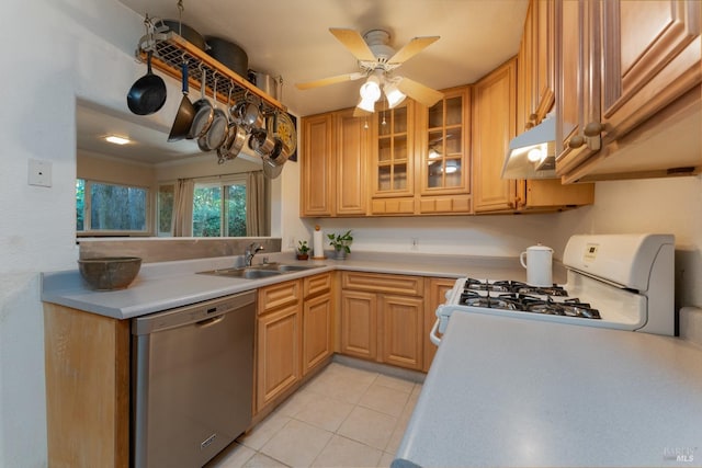 kitchen featuring gas range gas stove, sink, dishwasher, ceiling fan, and light tile patterned floors