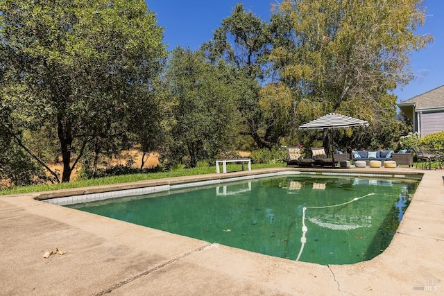 view of swimming pool featuring an outdoor hangout area and a patio area