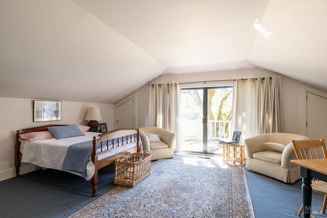 bedroom with lofted ceiling, carpet flooring, and access to exterior