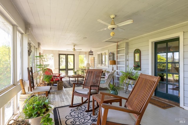 sunroom / solarium with ceiling fan