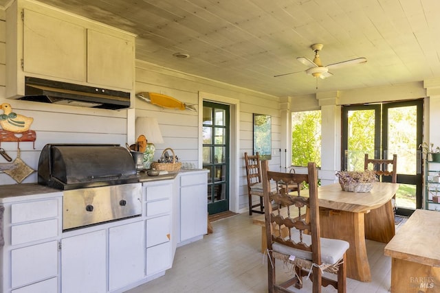 kitchen with ceiling fan, light hardwood / wood-style flooring, wooden ceiling, and white cabinetry