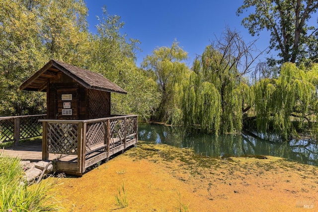 view of yard featuring a deck with water view