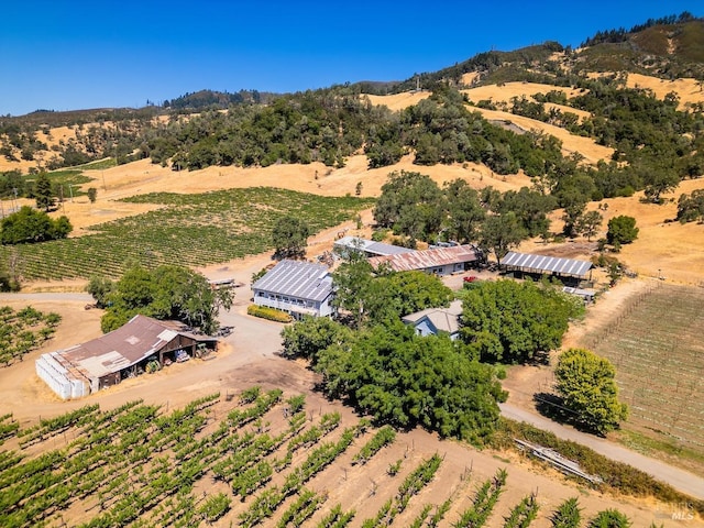 birds eye view of property with a rural view