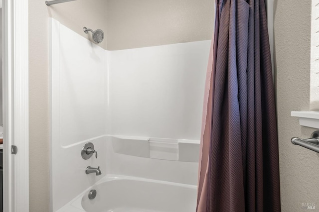 bathroom featuring shower / bathtub combination with curtain