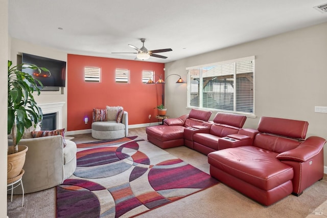 living room with ceiling fan and light colored carpet