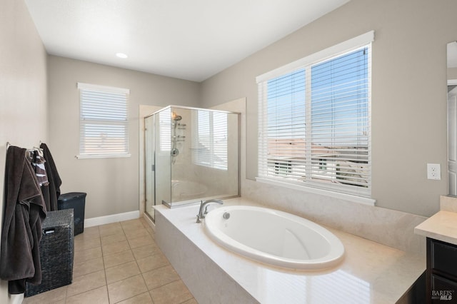 bathroom featuring tile patterned floors, vanity, and independent shower and bath