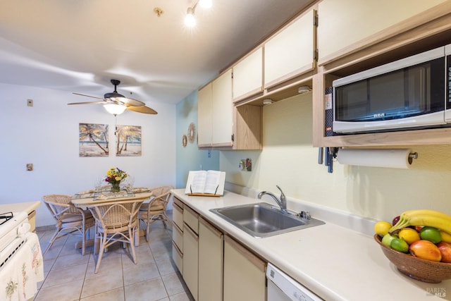 kitchen featuring dishwasher, ceiling fan, sink, and light tile patterned flooring