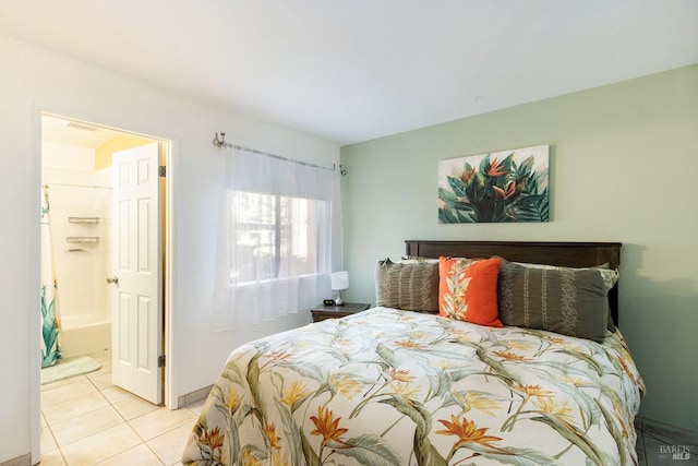 bedroom with light tile patterned floors