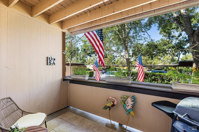 exterior space with beamed ceiling and wood ceiling