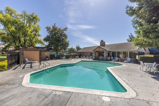 view of swimming pool featuring a patio