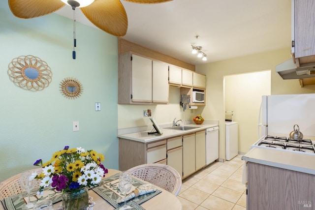 kitchen with sink, white appliances, ceiling fan, and light tile patterned flooring