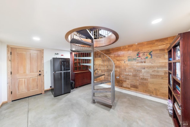 workout room with wood walls