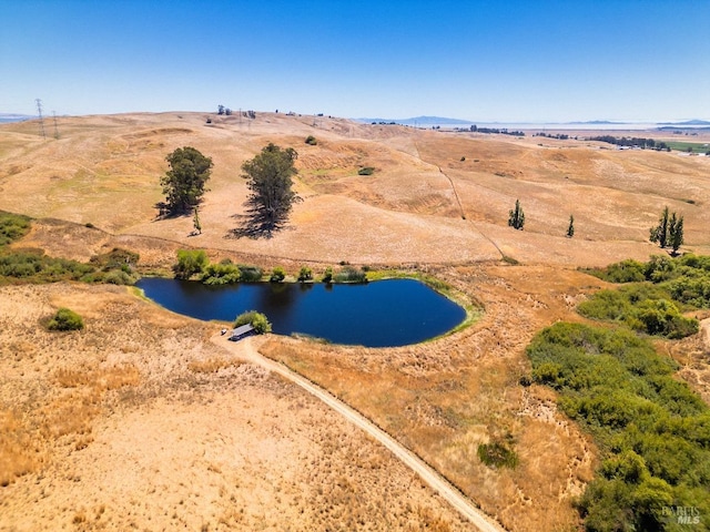 aerial view with a rural view and a water view