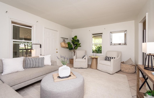 tiled living room with a healthy amount of sunlight