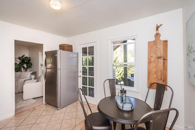 dining area with light tile patterned flooring