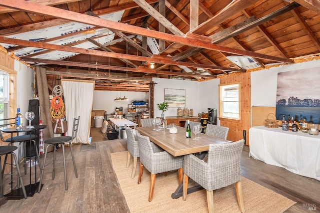 dining room featuring vaulted ceiling with beams, wooden ceiling, and dark wood-type flooring