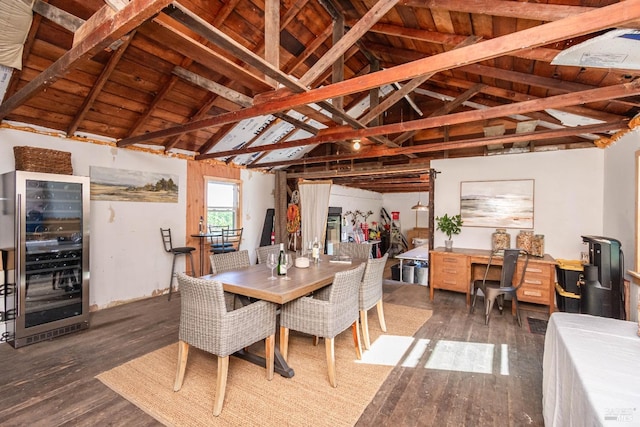 dining area featuring beam ceiling, wine cooler, wood ceiling, and dark wood-type flooring