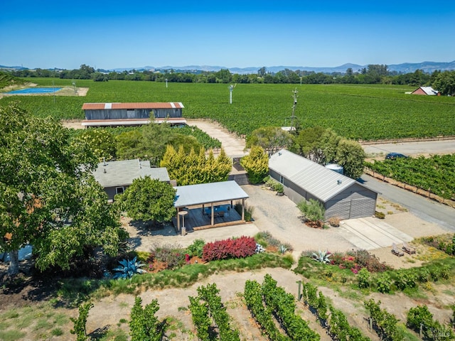 drone / aerial view featuring a mountain view and a rural view