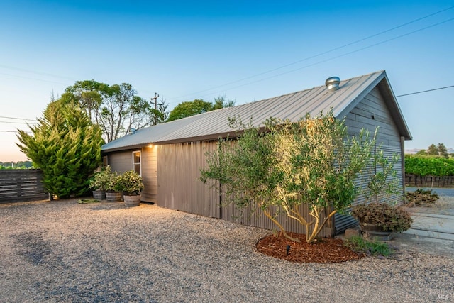 view of property exterior at dusk