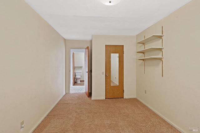 interior space featuring light colored carpet