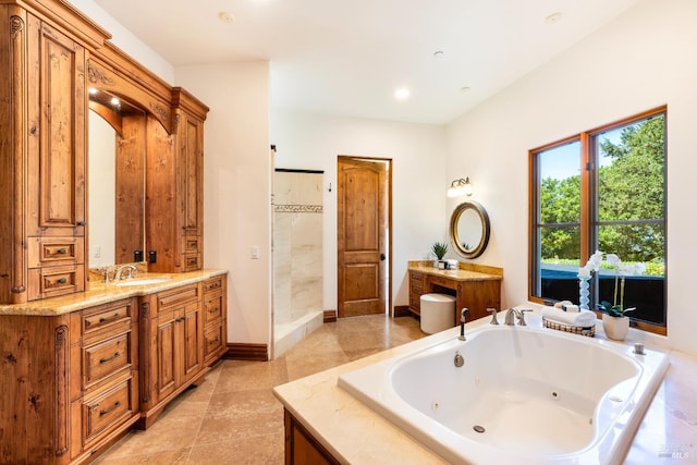 bathroom with vanity and separate shower and tub