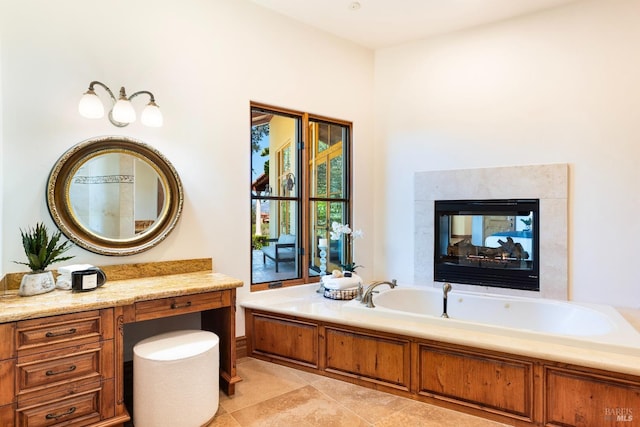 bathroom featuring a multi sided fireplace, a bath, and tile patterned flooring