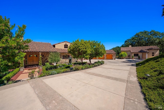 mediterranean / spanish house with a garage