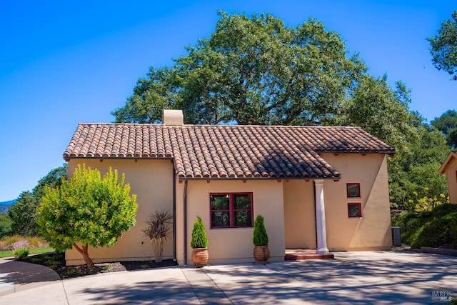 mediterranean / spanish-style home featuring a patio area